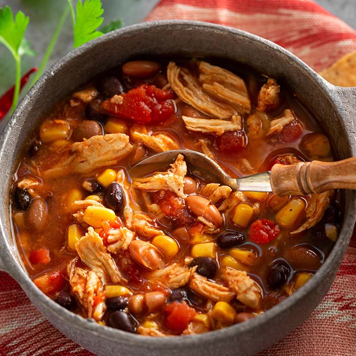 Southwest Smoked Chicken Chili - What a Crock delivers easy, prepared slow cooker & crockpot meals nationwide. America's easiest meal kit company. Boil in bag and instant pot dinners available.